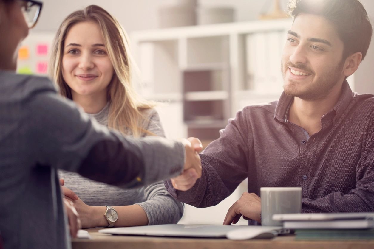 Lawyer meeting with clients about their estate plan